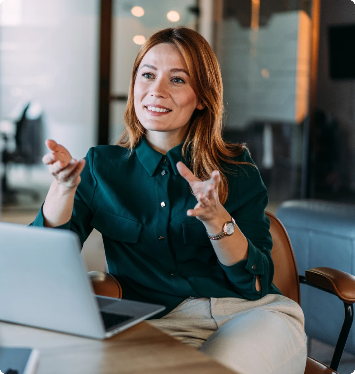 Smiling woman working on laptop